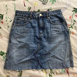 Raw edge denim mini skirt